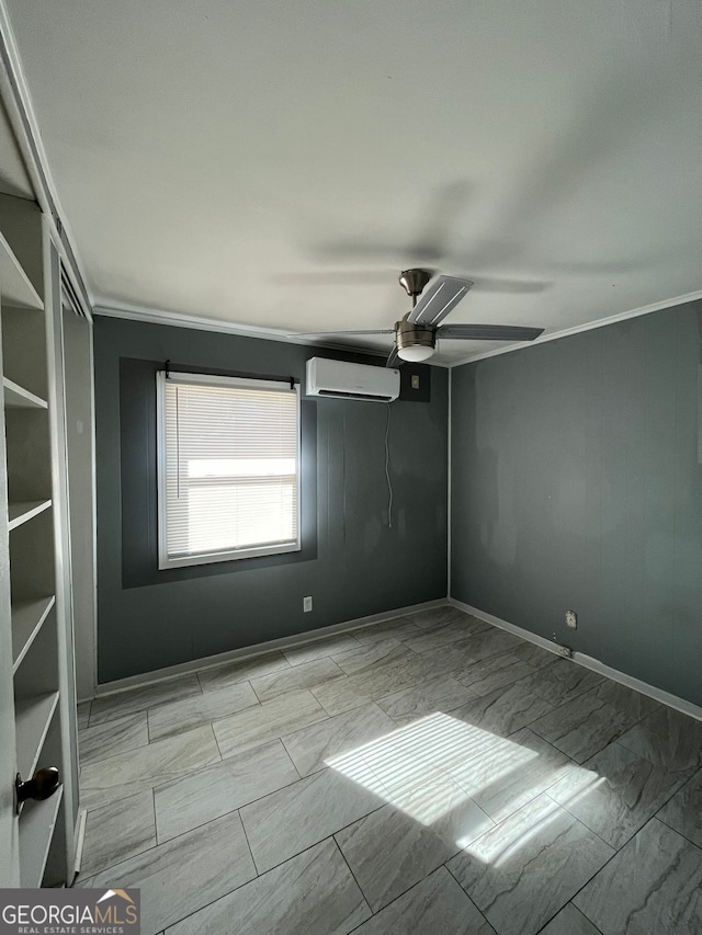 spare room with ceiling fan, ornamental molding, and a wall mounted AC