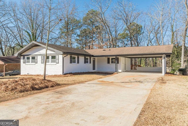 ranch-style house with a carport