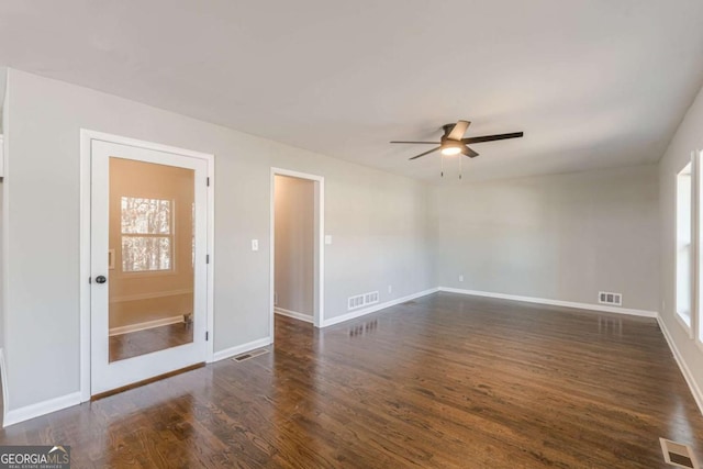 unfurnished room featuring ceiling fan and dark hardwood / wood-style flooring