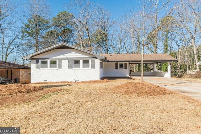 single story home featuring a carport