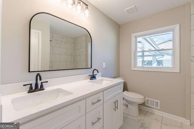 bathroom with vanity and toilet