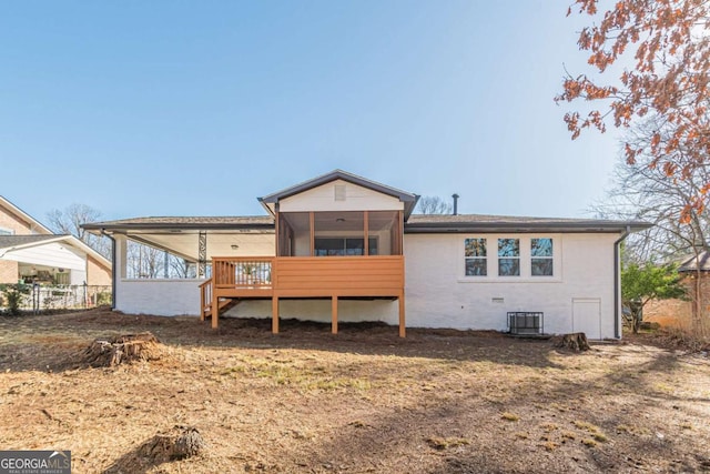 back of house with central AC and a sunroom