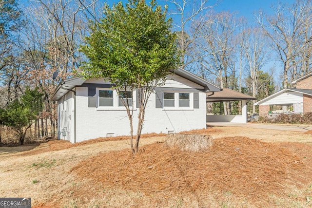 view of side of property featuring a carport