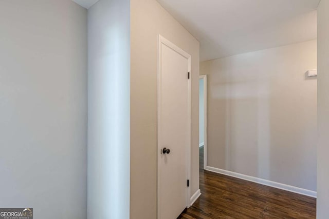 hall with dark hardwood / wood-style flooring