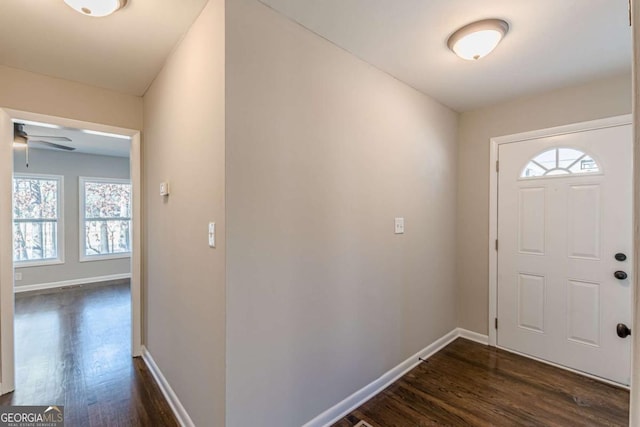 entryway featuring dark wood-type flooring and ceiling fan