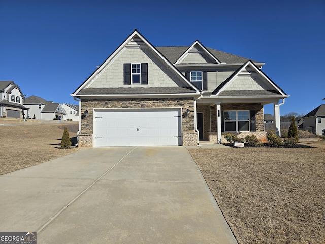 craftsman house with a garage and covered porch