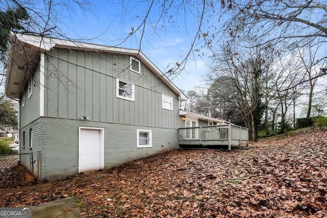 back of property with a wooden deck