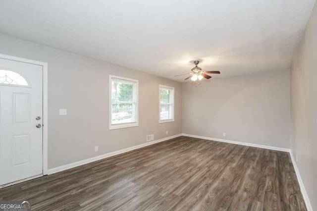 foyer with ceiling fan and dark hardwood / wood-style floors