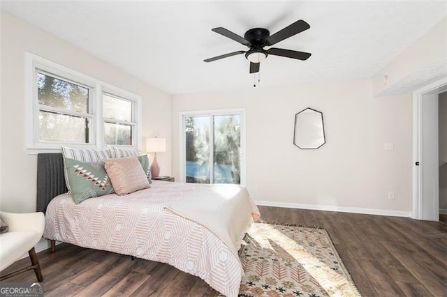 bedroom with ceiling fan and dark hardwood / wood-style flooring