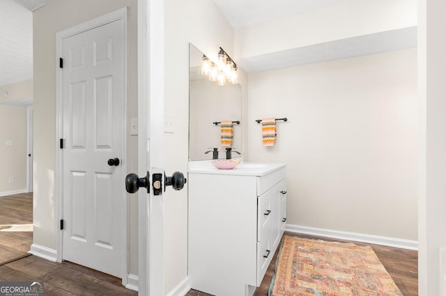 bathroom with vanity and hardwood / wood-style floors