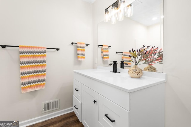 bathroom featuring vanity and wood-type flooring