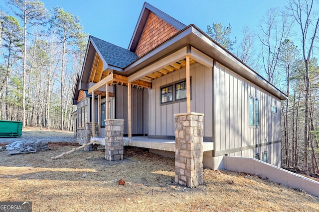 view of side of home with a porch