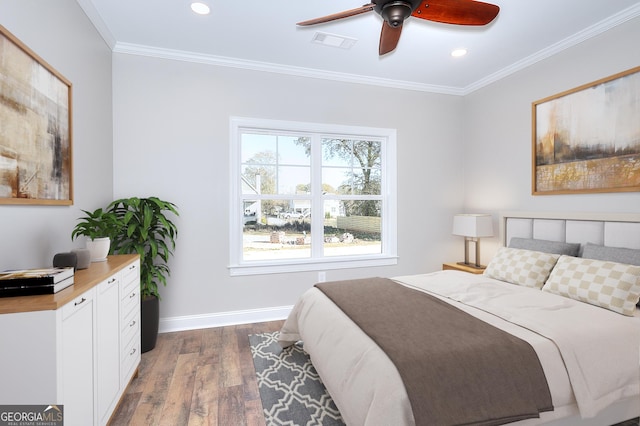 bedroom featuring ceiling fan, ornamental molding, and dark hardwood / wood-style floors