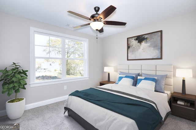 carpeted bedroom with ceiling fan