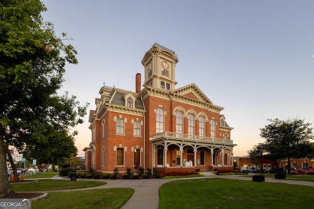 view of outdoor building at dusk