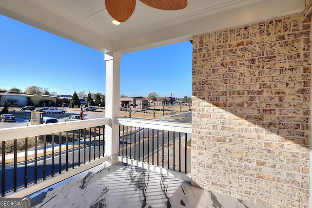 balcony featuring ceiling fan