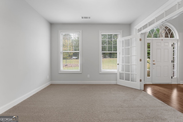 foyer entrance featuring hardwood / wood-style floors