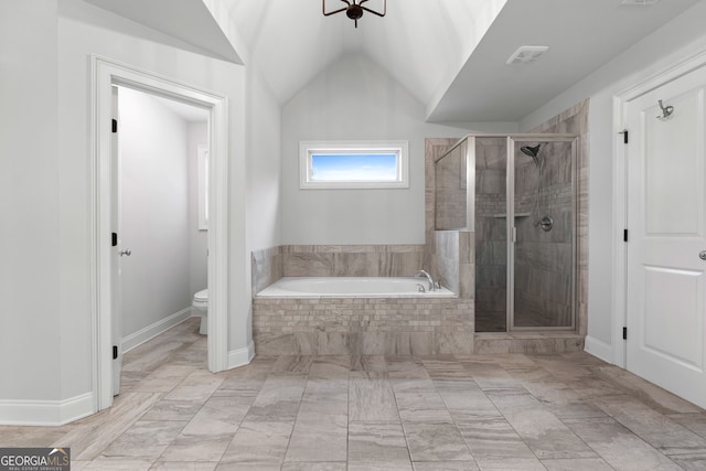 bathroom featuring shower with separate bathtub, lofted ceiling, and toilet