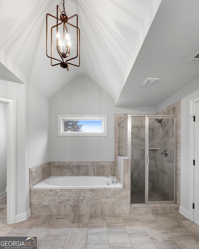 bathroom with plus walk in shower, lofted ceiling, and a notable chandelier