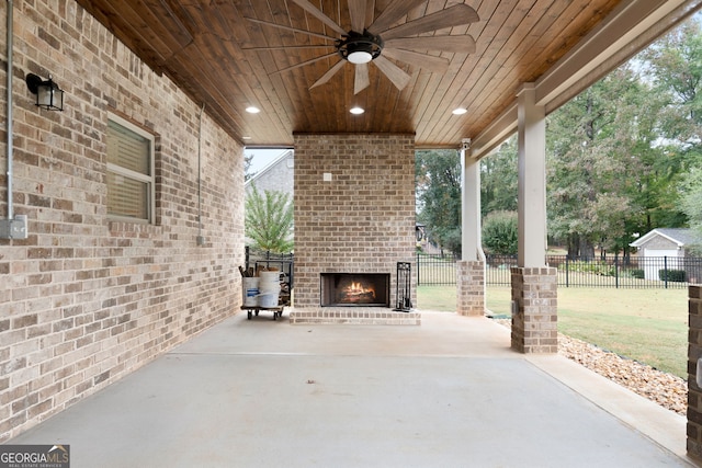 view of patio featuring an outdoor brick fireplace