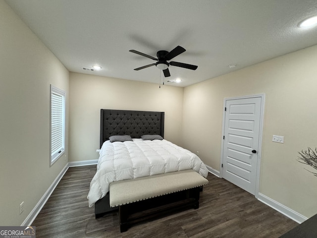 bedroom featuring ceiling fan and dark hardwood / wood-style floors