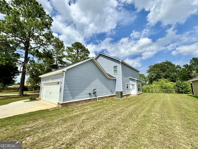 view of side of home featuring a garage, central AC unit, and a lawn