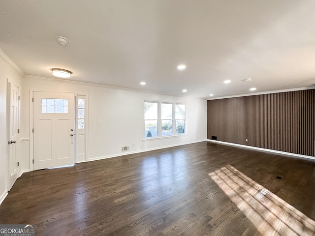 entryway with crown molding and dark wood-type flooring