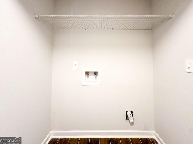 clothes washing area featuring dark wood-type flooring and washer hookup