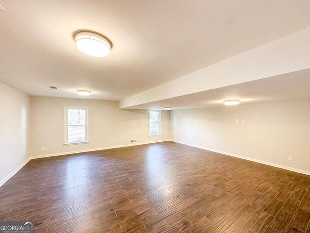 basement featuring dark hardwood / wood-style floors