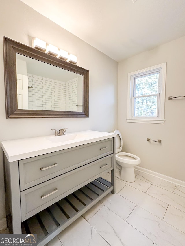 bathroom with vanity and toilet