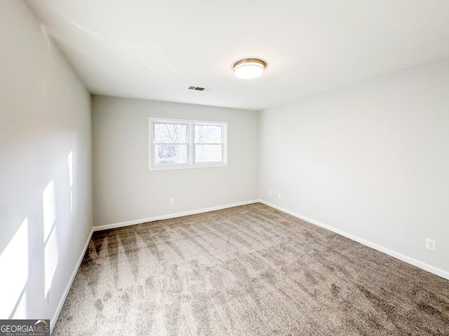 empty room featuring carpet flooring