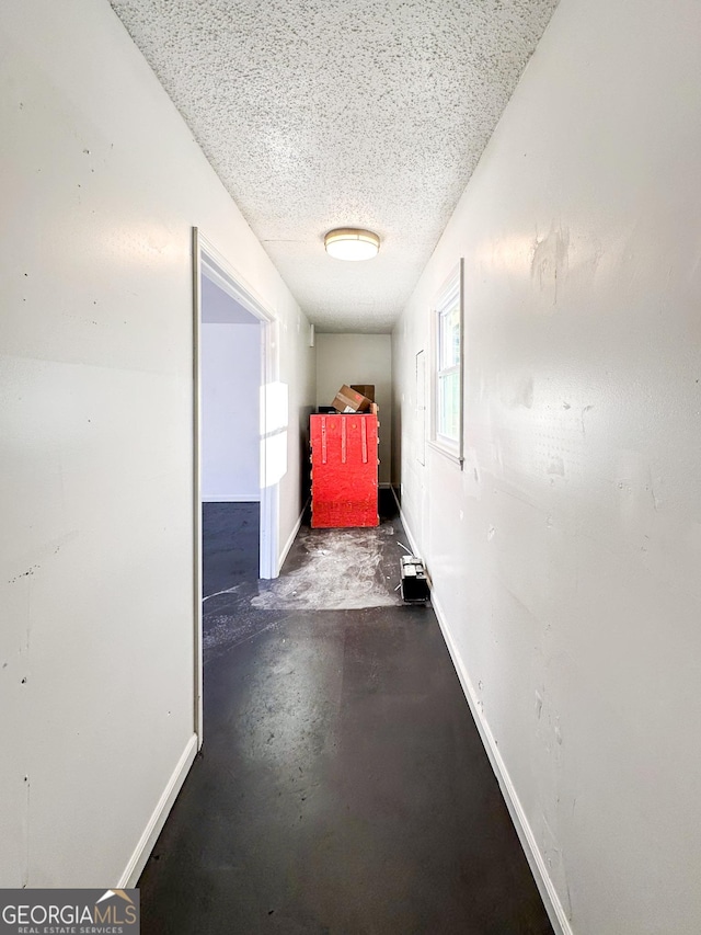 corridor with a textured ceiling