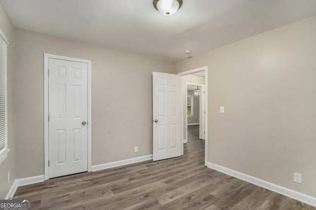 unfurnished bedroom with wood-type flooring