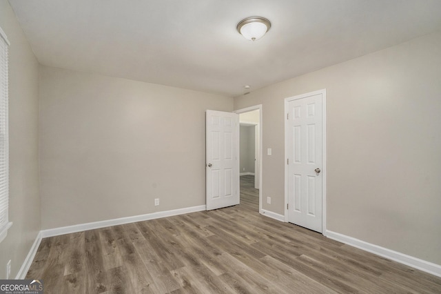 empty room featuring hardwood / wood-style floors