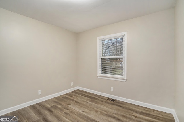 empty room featuring hardwood / wood-style floors