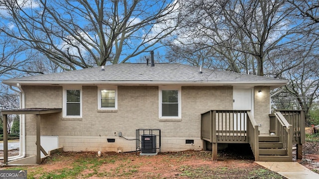 back of property featuring central AC unit