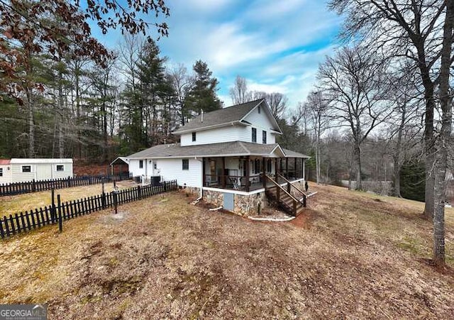 view of front of property with a sunroom