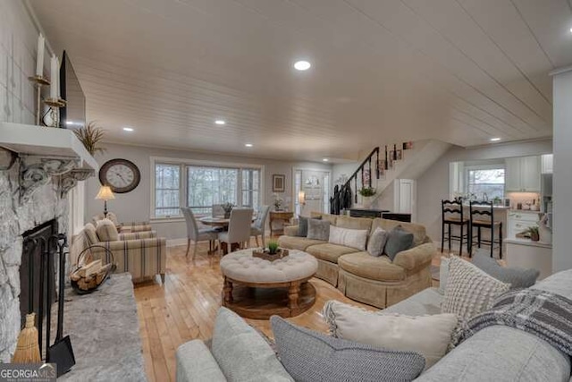 living room featuring a fireplace and light hardwood / wood-style floors