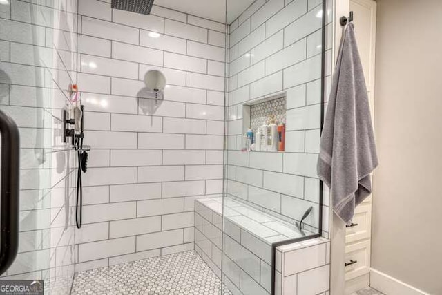 bathroom with tiled shower