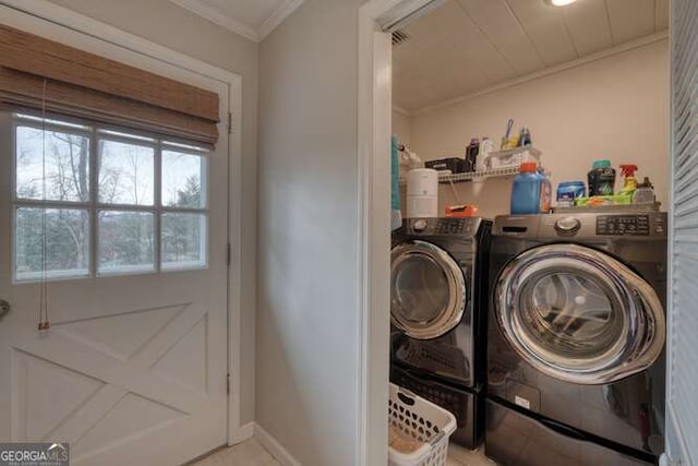 clothes washing area featuring crown molding and independent washer and dryer