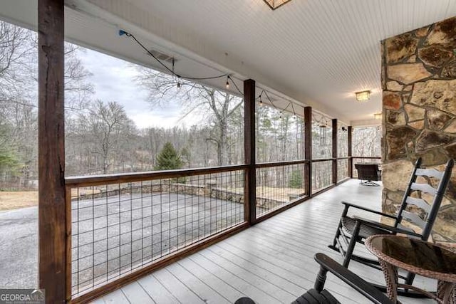 unfurnished sunroom featuring a wealth of natural light