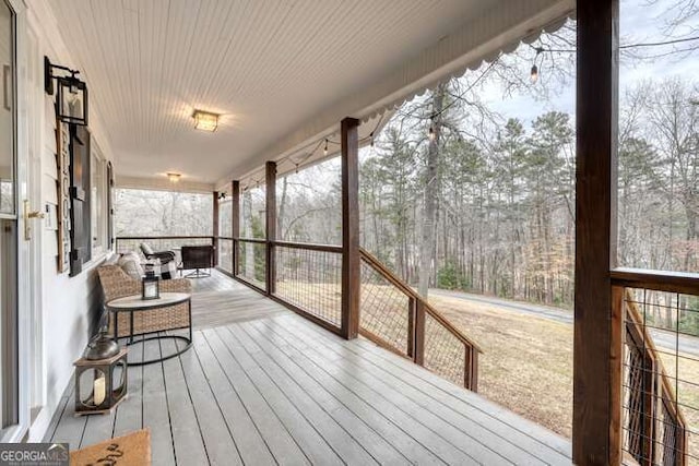 wooden terrace featuring a porch