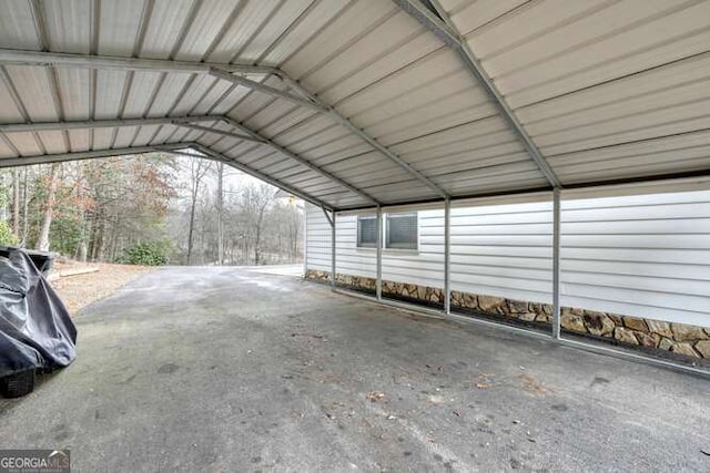 view of parking / parking lot featuring a carport