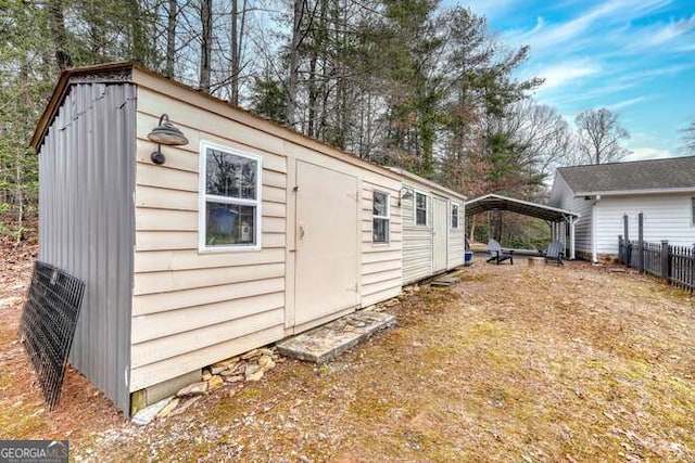 view of outbuilding featuring a carport