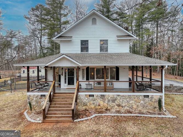 farmhouse inspired home featuring covered porch