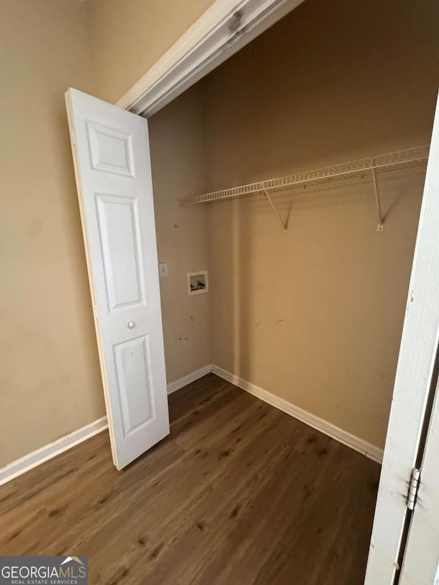 clothes washing area featuring washer hookup and dark hardwood / wood-style floors