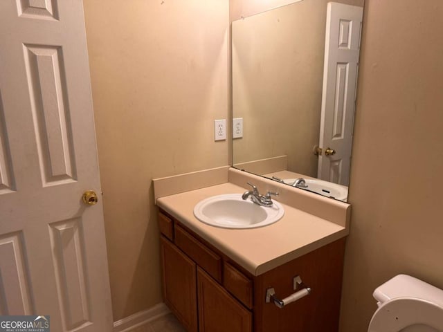 bathroom with vanity and toilet