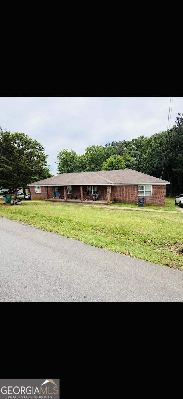 241 E Ash St, Social Circle, GA 30025 - view of front of house with a front yard