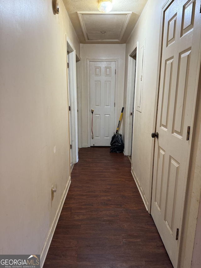 241 E Ash St, Social Circle, GA 30025 - corridor with attic access, dark wood-style floors, and baseboards
