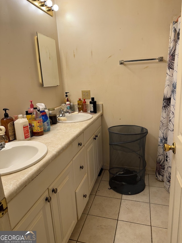 241 E Ash St, Social Circle, GA 30025 - full bath with tile patterned floors, double vanity, and a sink